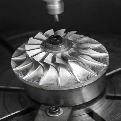 Metalworking CNC milling machine. Metalworking CNC milling machine. Cutting metal modern processing technology. Small depth of field. Warning - authentic shooting in challenging conditions. A little bit grain and maybe blurred.